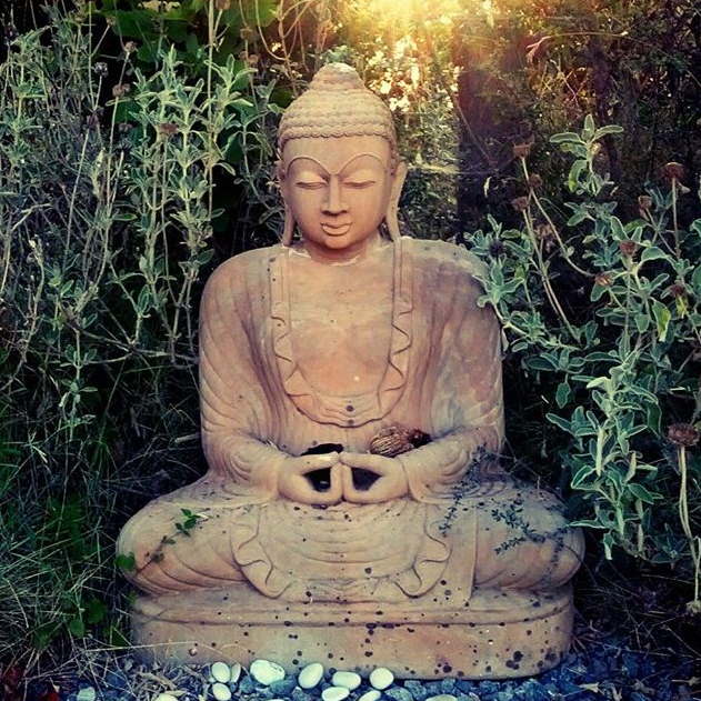 Buddha statue among greenery